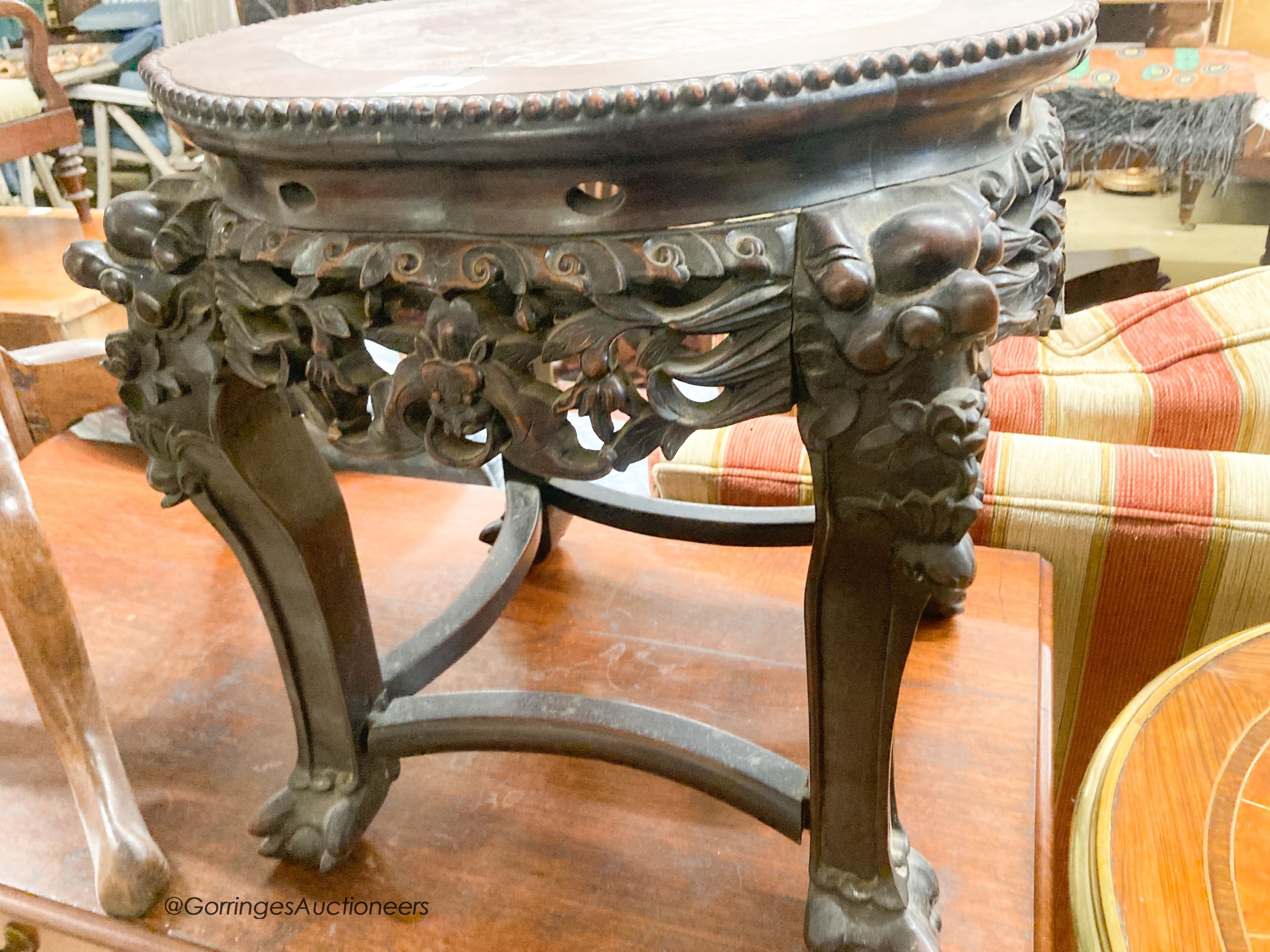 A Chinese carved hardwood jardiniere stand with rouge marble inset top, width 44cm, height 45cm